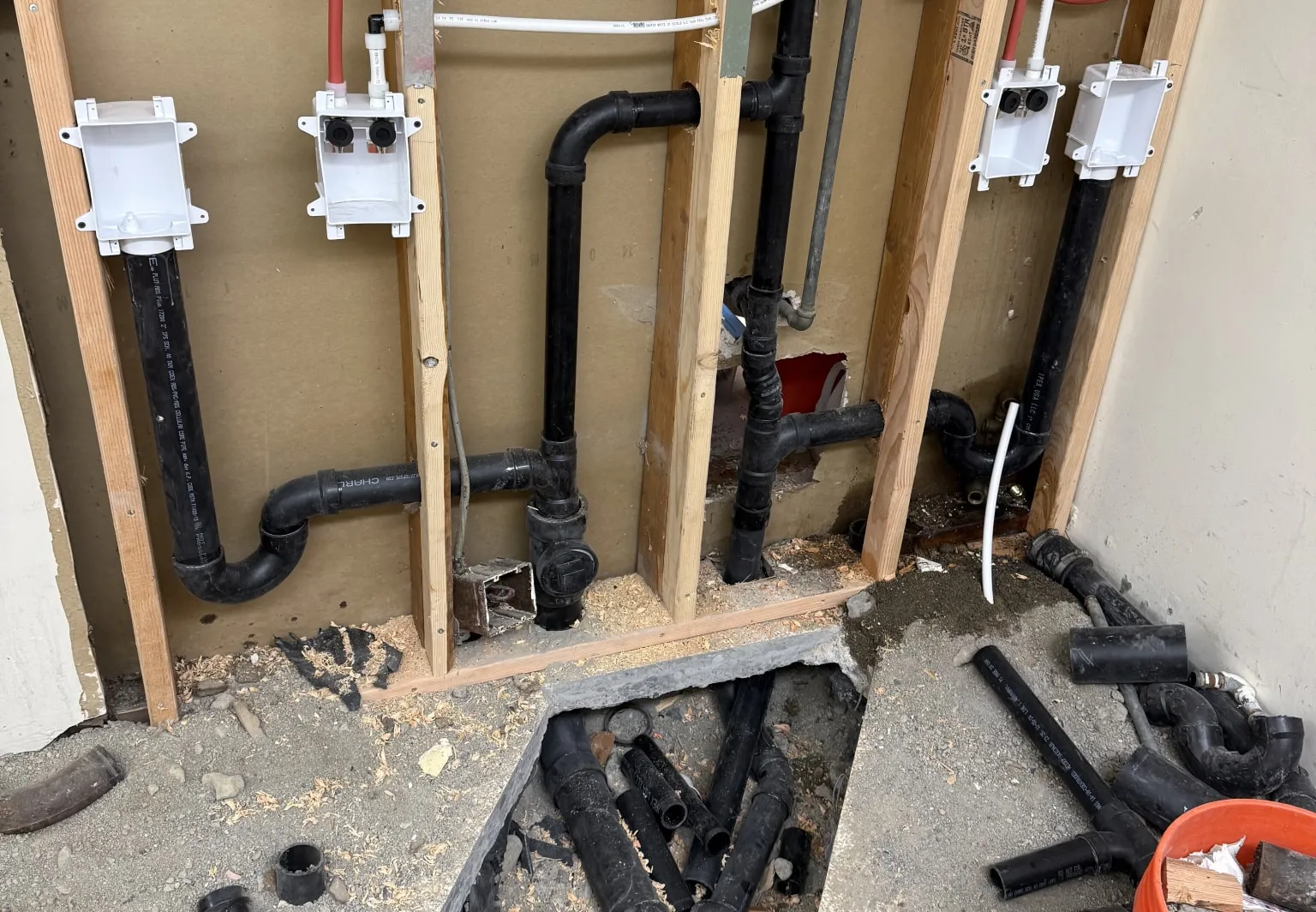 Pipe installation behind drywall.